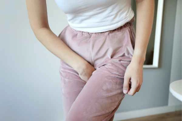 woman struggling with urine incontinence Enfield Lock