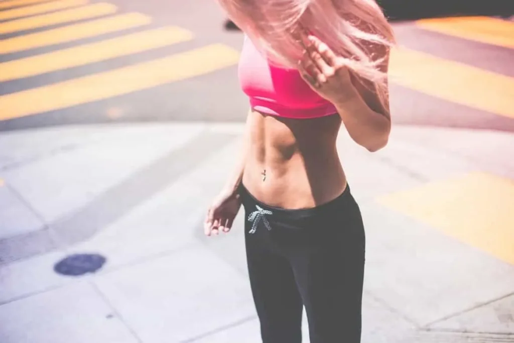 Woman with toned stomach after LA-EMS Body Sculpting Treatment Enfield Lock